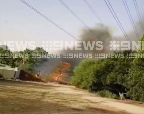 The fire spread to properties. (9NEWS)