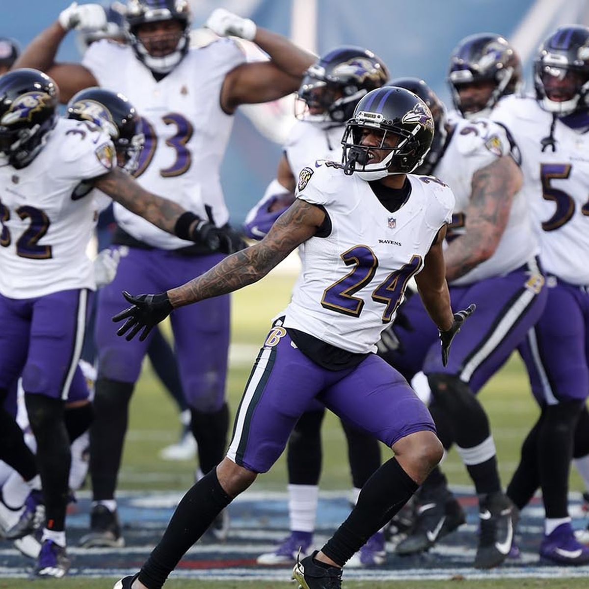 Ravens players dance on Titans' logo after fourth-quarter INT