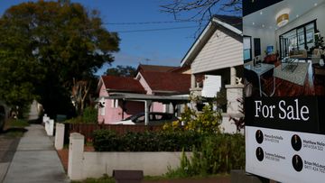 A real estate sign is seen at a property in Croydon Park in Sydney, Australia