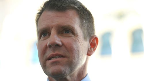 NSW Premier Mike Baird speaks about the resignation of MPs following ICAC revelations during a media conference in Sydney. (AAP Image/Paul Miller)