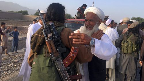 Taliban fighters gather with residents to celebrate a three-day cease fire marking the Islamic holiday of Eid al-Fitr, in Nangarhar province, east of Kabul, Afghanistan. Picture: AP