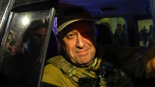 Yevgeny Prigozhin looks out from a military vehicle on a street in Rostov-on-Don, Russia