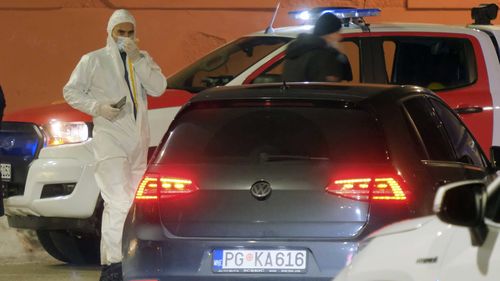 Police investigators work at the site of a shooting in Cetinje, 36 kilometres west of Podogrica, Montenegro.