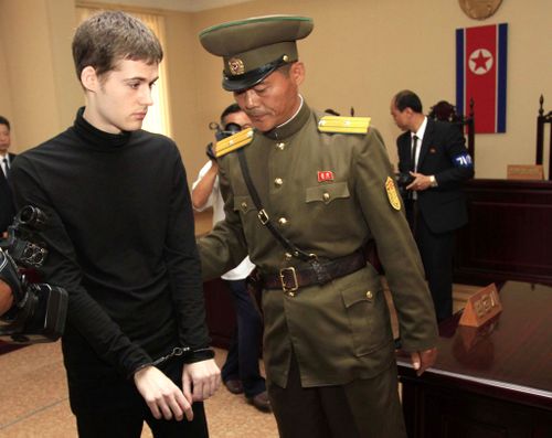 Handcuffed, American Matthew Miller leaves after his trial at the Supreme Court in Pyongyang, North Korea. (AAP)