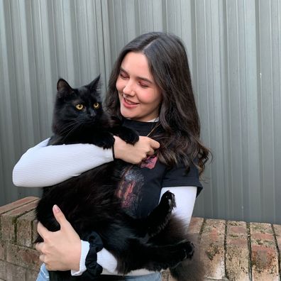 Maddison Leach with her rescue cat Kovu, who was a 'black mark' against her in Sydney's rental market.