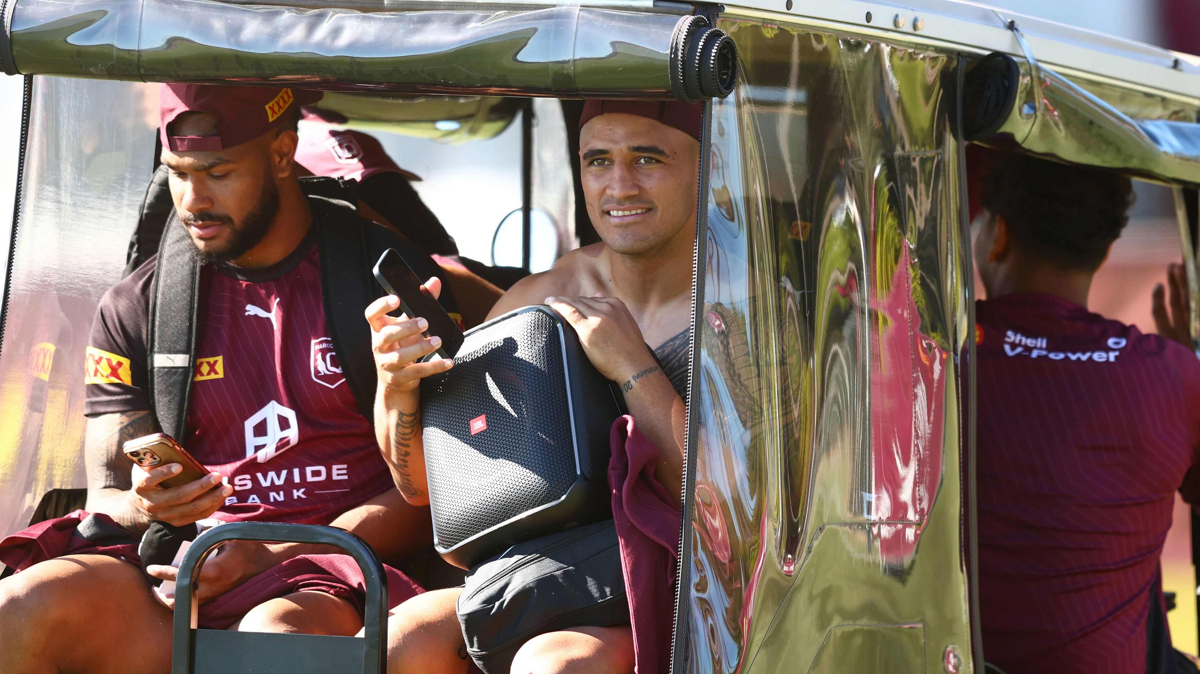 Valentine Holmes (right) was one of the Queensland players sprayed by Daly Cherry-Evans at training. 