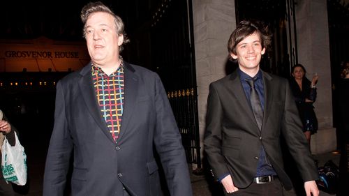 Newly engaged couple Stephen Fry and Elliott Spencer appear in court