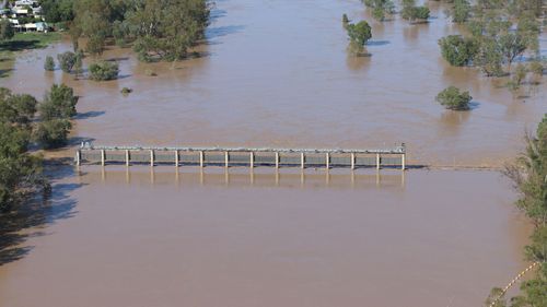 A supplied image obtained on Thursday, February 27, 2020, shows a swollen Balonne river flooding the Andrew Nixon bridge in St George, south-western Queensland. The Balonne river has peaked at 12.2 metres, causing local flooding.