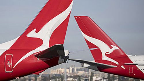 Qantas jet tails at Sydney Airport (Getty)