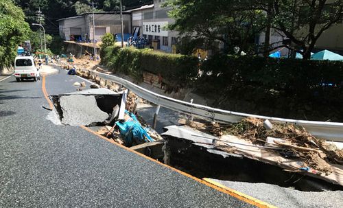 The flooding has torn up transport links such as this road. (Photo: AP).