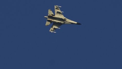 A military fighter jet flies above the Taiwan Strait on Friday, August 5, 2022.