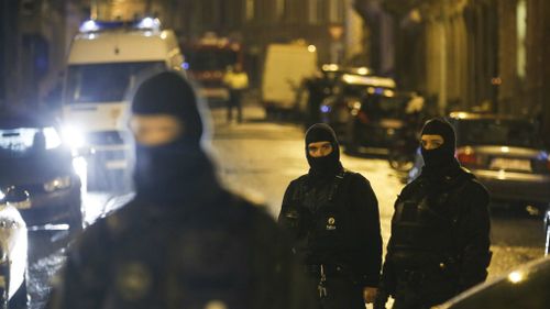 Heavily-armed special forces police remain at the scene in Verviers as well as carrying out new raids across the country. (AP)