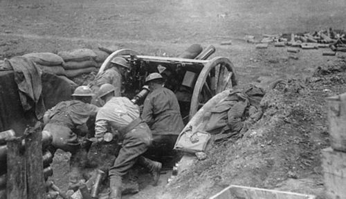 Australian artillery gunners in action at Bullecourt. (Photo: Australian War Memorial).