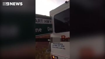 Tourists drive van through sign on Northern Territory highway