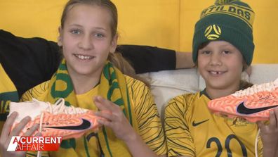 Vienna, 11, and Amalia Gergely-Hollai, 8, with Sam Kerr's boots.