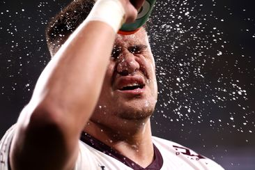 Josh Schuster of the Sea Eagles sprays water on his face in a break of play in their round 11 match against the Eels. 