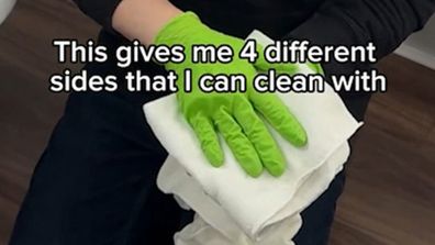 Janitor Brandon Pleshek shows how to fold a cleaning cloth for best results