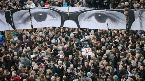 More than 1.5m people pour through streets of Paris in historic tribute march