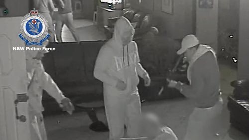 Police are hunting three men who robbed two Sydney brothels earlier this year while armed with a paintball gun. Picture: Supplied.