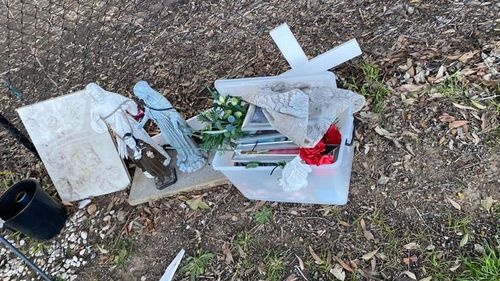 Parts of the temporary roadside memorial removed on Bettington Road, Oatlands.