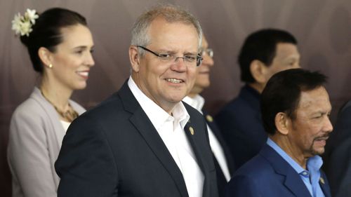 Australia's Prime Minister Scott Morrison, center, poses for a group photo at APEC Haus in Port Moresby, Papua New Guinea.