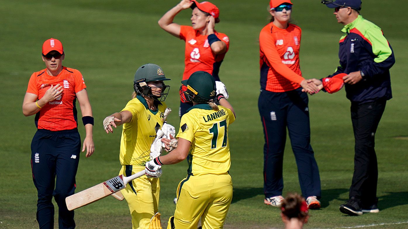Ellyse Perry celebrates with team-mate Meg Lanning after they defeat England during the third Vitality International T20 