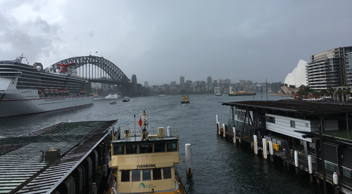 Thick storm clouds filled Sydney Harbour's skyline as commuters began the trip home this evening.