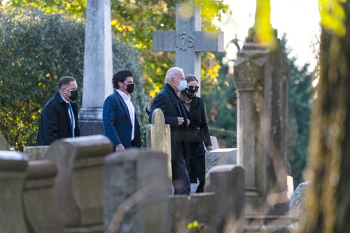 Democratic presidential candidate former Vice President Joe Biden walks with his granddaughter Finnegan Biden into St. Joseph On the Brandywine Catholic Church in Wilmington