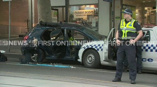 Officers located two firearms in the man's car. (9NEWS)