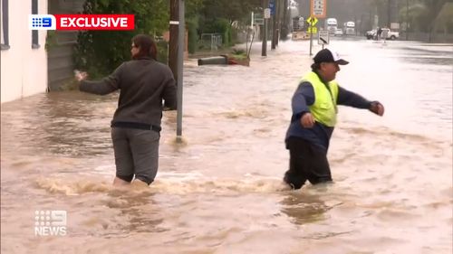 The main street of Inglewood, tucked in a bend of a rising Canning Creek in the Darling Downs, was underwater this morning.