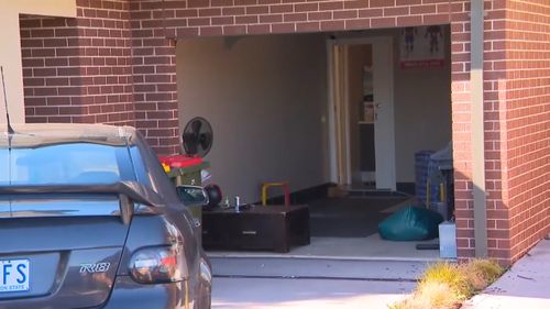 Neighbours report seeing the man packing belongings into a white van two nights ago. He appeared 'agitated' (9NEWS)