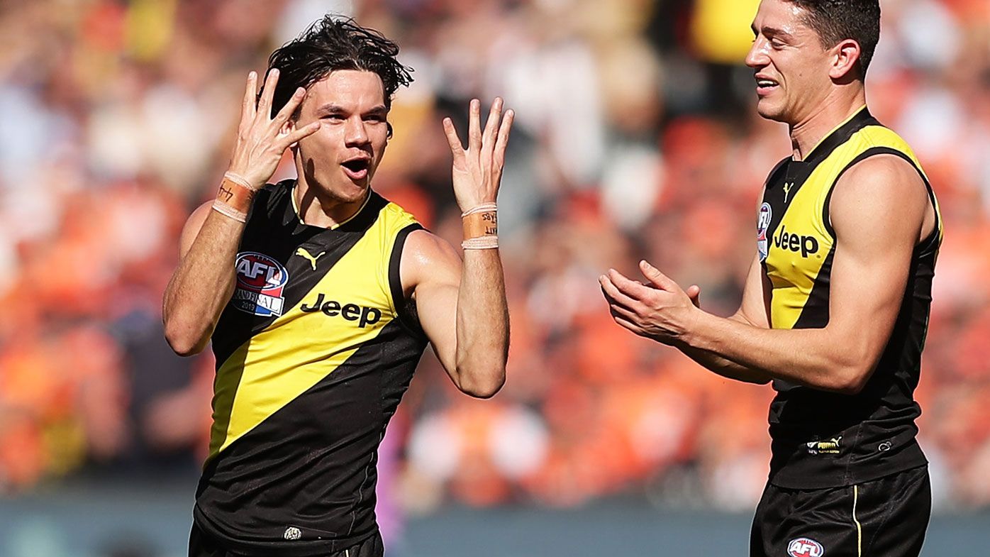 Daniel Rioli of the Tigers celebrates with team mates after kicking a goal during the 2019 AFL Grand Final 