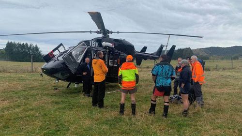 Searchers get a safety briefing from Southern Lakes Helicopter crew before they continue searching for Invercargill man Alan Mortimore and his14-year-old son Danny in a forest near Lake Hauroko.