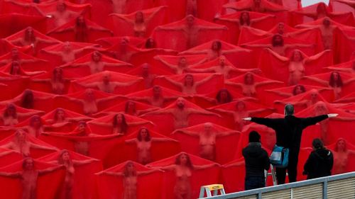 "Arms up!": Tunick directs his subjects. Picture: AAP