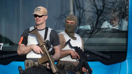 Armed police stand guard at the scene. (DPA)