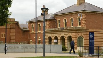 A Corrections Officer walks past the Goulburn Correctional Centre in Goulburn. The High Risk Management Correctional Centre which is part of the Goulburn Correctional Centre has undergone a refurbishment. Goulburn, NSW. 22nd November, 2021. Photo: Kate Geraghty