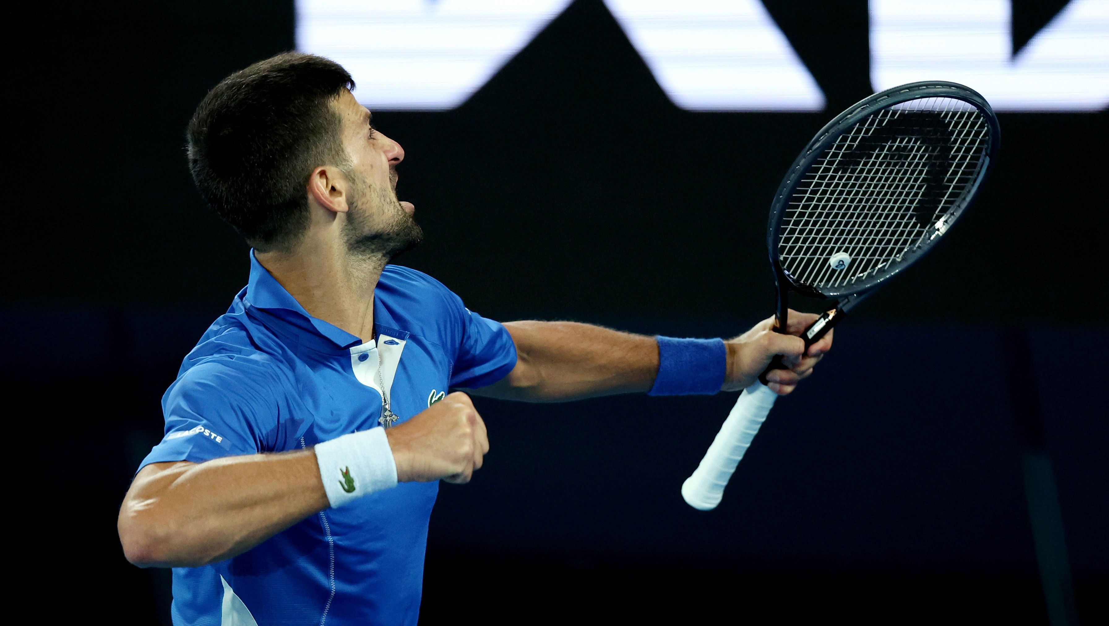 Novak Djokovic celebrates after clinching victory in his second round match against Alexei Popyrin at the Australian Open.