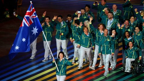 Australian Flag bearer and Cyclist Anna Meares leads the Australian athletes. (Getty Images)