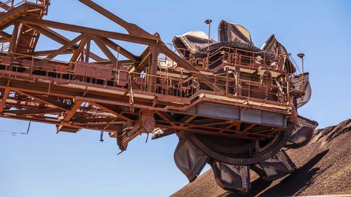 A reclaimer at the ore stockpile at the BHP Jimblebar facility in the Pilbara region of Western Australia.