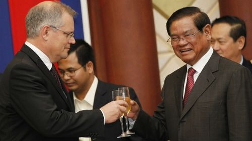 Morrison's champagne toast to seal Cambodian refugee deal a fizzer