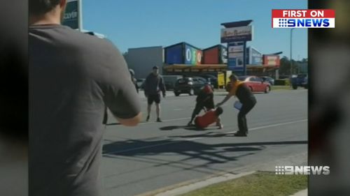 Bystanders detained the woman until police arrived. (9NEWS)