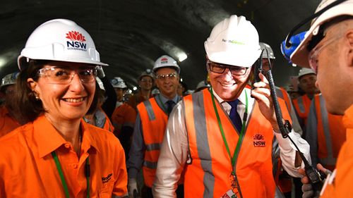 Then Prime Minister Malcolm Turnbull and NSW Premier Gladys Berejiklian give the go ahead for the first tunnel breakthrough of the NorthConnex project in West Pennant Hills in Sydney, December 2017. (AAP)