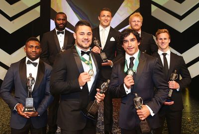 The joint winners pose in front of the Dally M team of the year. (Getty)