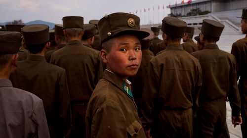 North Korean soliders tour the mausoleum where the bodies of Kim Il Sung and Kim Jong Il lie embalmed.