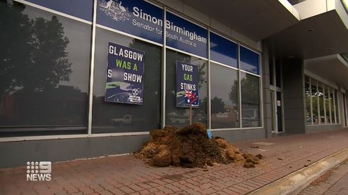 The protesters said the move was to depict Australia's performance at the recent COP26 climate summit in Glasgow.