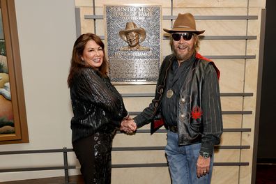 Mary Jane Thomas and 2020 inductee Hank Williams Jr. seen during the 2021 Medallion Ceremony, celebrating the Induction of the Class of 2020 at Country Music Hall of Fame and Museum on November 21, 2021 in Nashville, Tennessee.