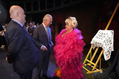 Chief Executive of the Grand Opera House Belfast, Ian Wilson (left) with Prince Charles, Prince of Wales and drag queen May McFettridge (right)  at the re-opening of the Grand Opera house, Belfast, on the second day of a two-day visit to Northern Ireland, on March 23, 2022 in Belfast, Northern Ireland. 