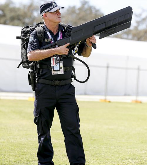 The DroneShield DroneGun MKII works by jamming the signal between a drone operator and the device itself, allowing police to safely bring it to the ground and stop it recording vision of the event or of venues from above. Picture: AAP.