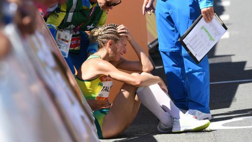 Claire Tallent is inconsolable after being disqualified from the race. (AAP)