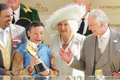 Frankie Dettori (2nd L) on Courage Mon Ami celebrates winning the Gold Cup while standing next to King Charles III (R), Queen Camilla (2nd R) and guest (L) on day three of Royal Ascot 2023 at Ascot Racecourse on June 22, 2023 in Ascot, England 